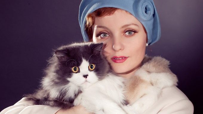 model holding cat