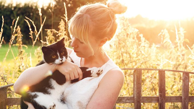 woman holding cat