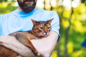 Young man with cat