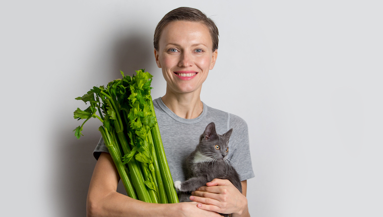 Woman and kitten and celery